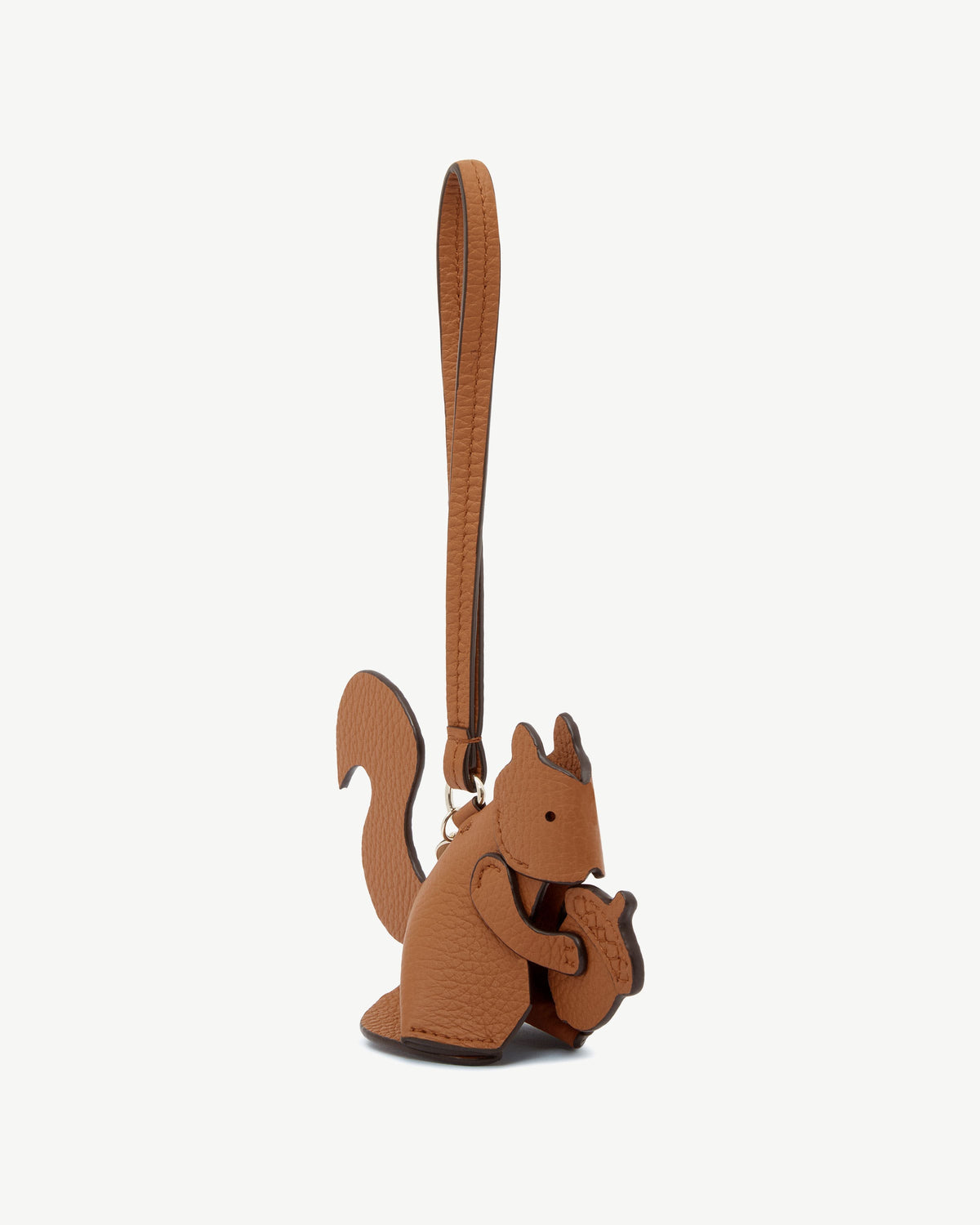 Tan leather squirrel-shaped bag charm with strap and gold ring