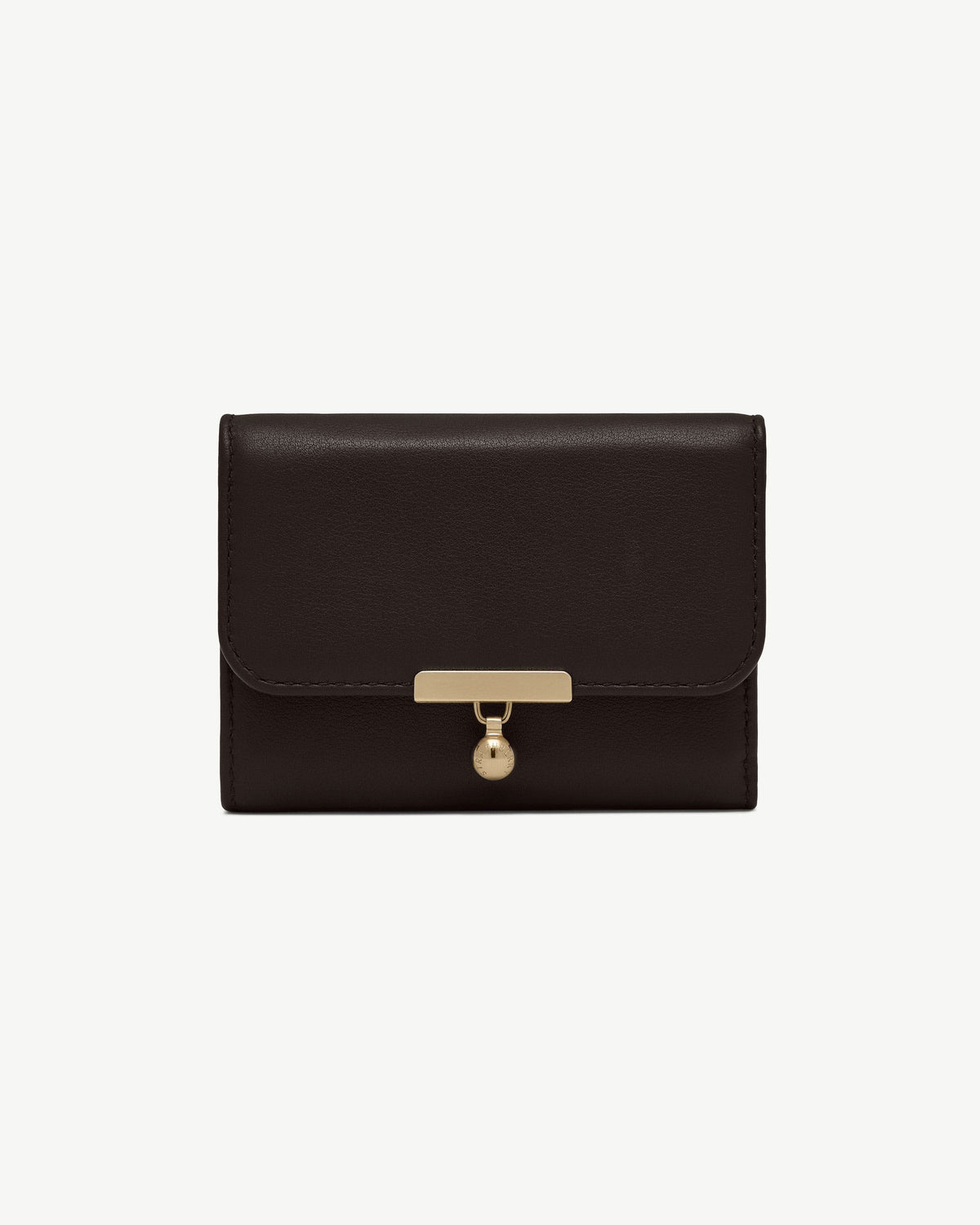 Espresso leather trifold wallet with gold bar clasp and circular charm.